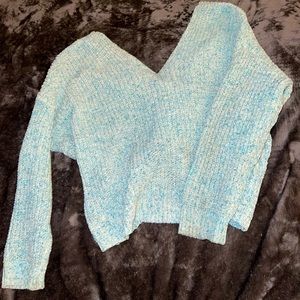 Light blue sweater with a crisscross open back
